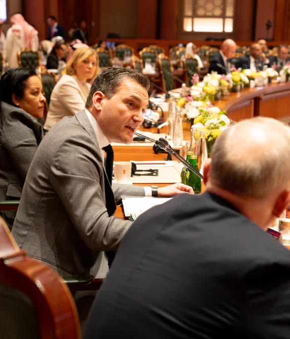 Minister Solomon speaking during a meeting.