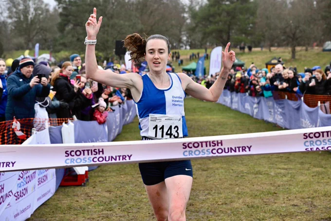 Athlete crossing finish line