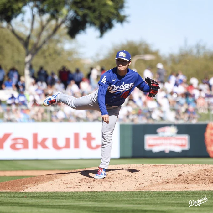 A photo of Yoshinobu Yamamoto pitching on the mound.