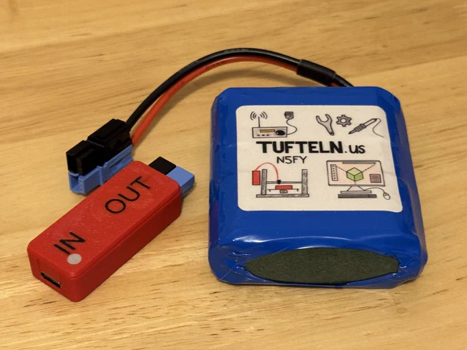 The Tufteln 3S1O 5Ah LiPo battery (rated 55Wh) with Tufteln USB-PD to 12.6V charger.