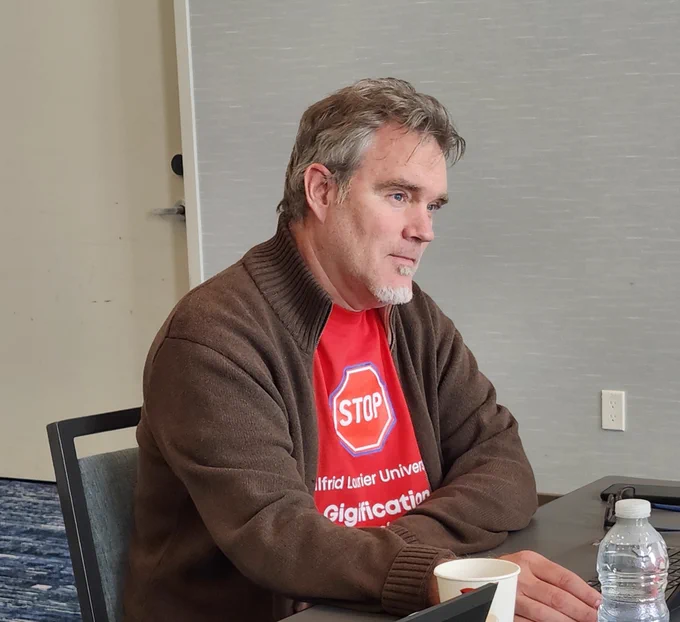 Brent Hagerman listening to the conversation of the Team while caucusing at mediation