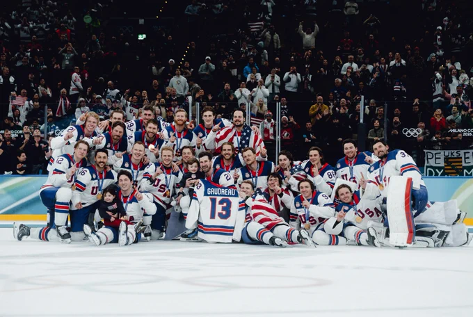 Photo of Team USA posing with gold medals 