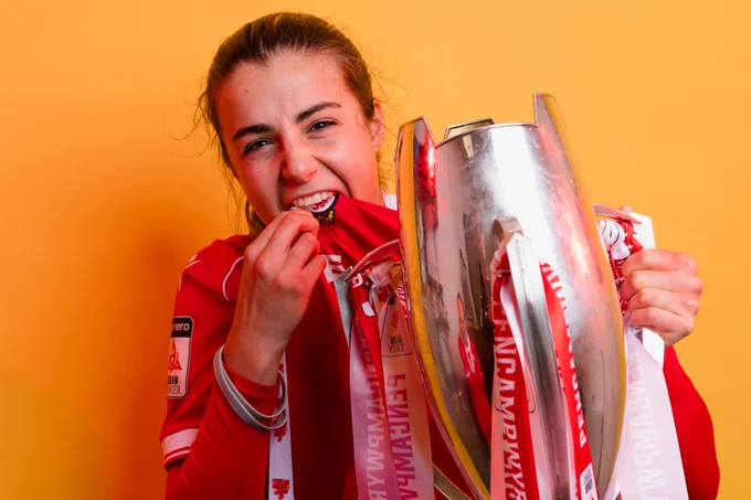 Ava Suckley celebrates with the Genero Adran Trophy.