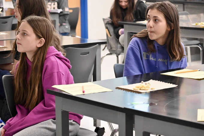 Students watch a career day presentation