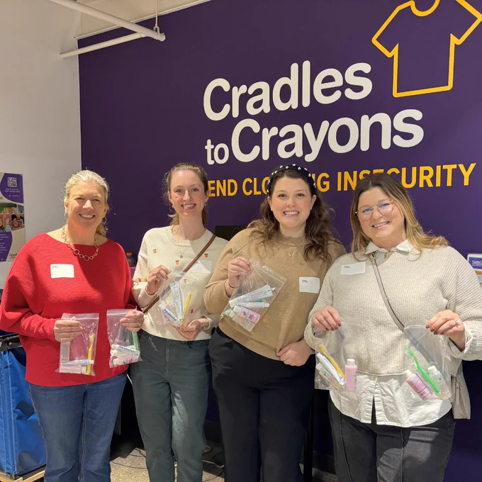 (Left to right) Whitney Kellett, Caroline Hromy, Cassidy Dabrow, and Krista Seng with the toiletry bags packed for babies at Cradles to Crayons Philadelphia’s Women Making a Difference Event.
