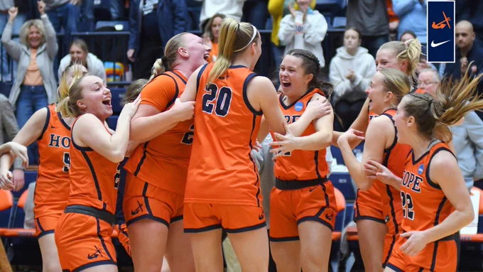 Hope women's basketball players celebrate on the court.