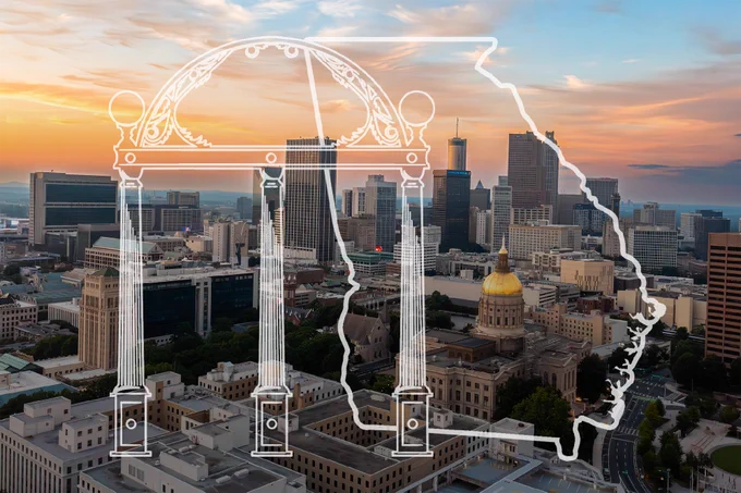 A cityscape of downtown Atlanta with tall buildings under a sunset sky. A white outline of Georgia's state shape overlays the image, along with a white illustration of the University of Georgia arch.