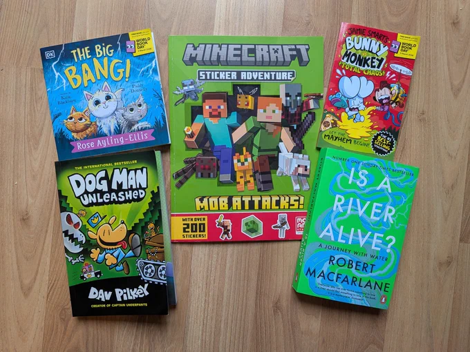 Four children's books (2 world book day titles, Dog Man and Minecraft Sticker adventure) and one adult book Is A River Alive? 