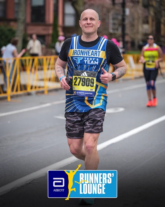 Photo of Jeremy Woodward running the Boston Marathon with the “Abbott Runners’ Lounge” badge overlayed at the bottom center