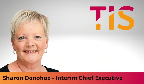 Portrait of Sharon Donohoe, TIS Interim Chief Executive Officer, with the TIS logo.