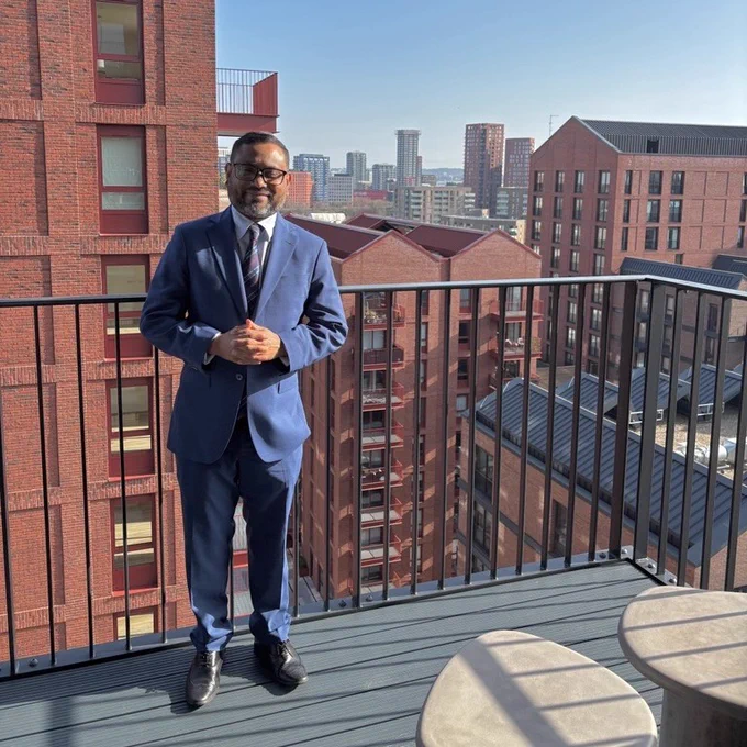 The Deputy Mayor of Tower Hamlets, Cllr Maium Talukdar on a balcony