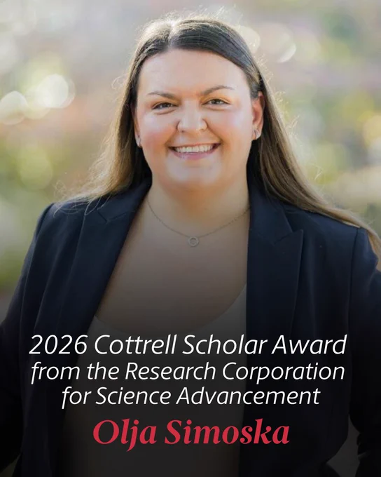 The image shows a person smiling and wearing a dark blazer. Text on the image reads: "2026 Cottrell Scholar Award from the Research Corporation for Science Advancement, Olja Simoska." The background is softly blurred with warm tones.