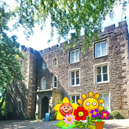 Clitheroe Castle Museum in the sunshine with cartoon flowers