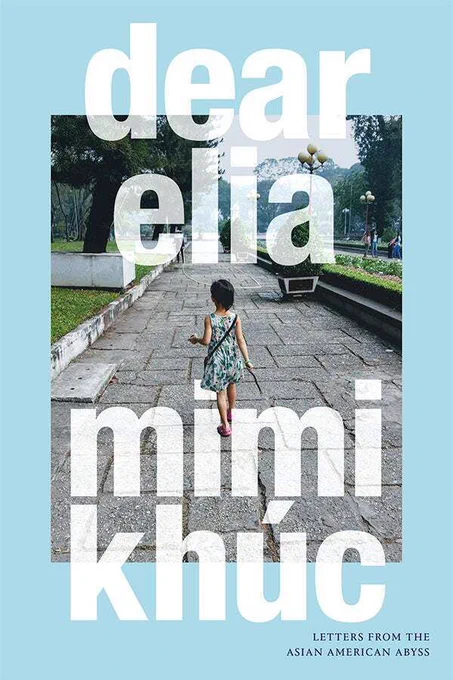 Cover of dear elia: letters from the Asian American abyss by Mimi Khúc.Cover has a light blue background, with a photograph in the center of the page. The photograph depicts a young girl in a floral dress and pink shoes. She holds a stick and walks down an empty path, lined on each side with grass and bushes.