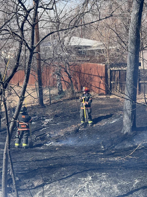 Firefighters working a grass fire