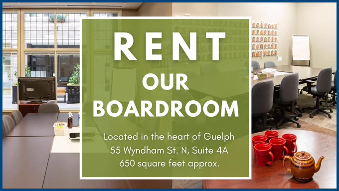 Modern boardroom with large windows, multiple chairs, and a TV, available for rent in downtown Guelph at 55 Wyndham St. N, Suite 4A.