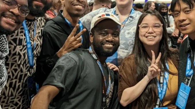 Ludovic [center] poses with a group of friends at the Combo Breaker fighting game tournament