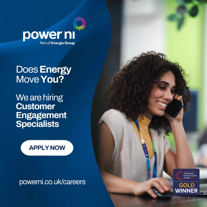 Customer engagement specialist speaking on phone at desk in modern office setting for Power NI recruitment ad.