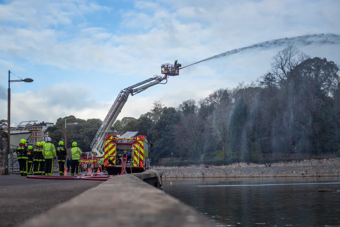 Water being squirted from an aerial ladder platform