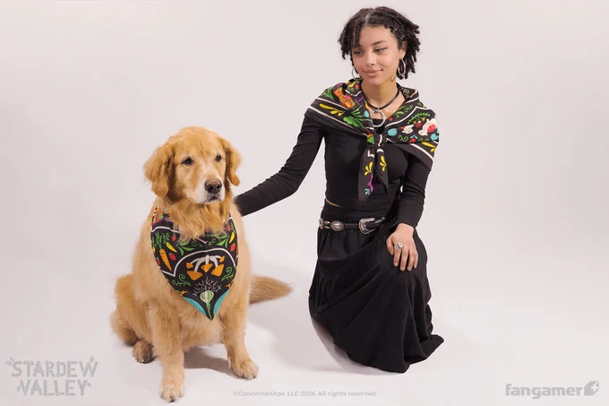 A photo of dog and human models showing off how the Folkloric scarf, a new square Stardew Valley scarf, can be tied around your neck or shoulders. 