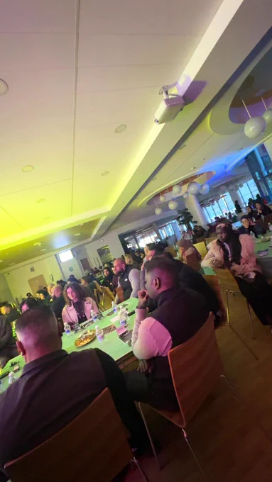 Diners watching a presentation. 
