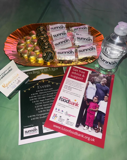 Leaflets and small food items on a table.
