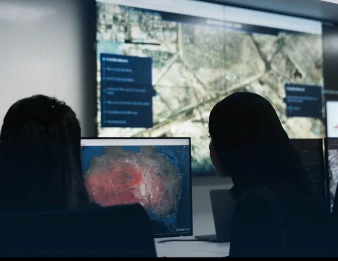 Assessing post-disaster satellite data. Photo taken by UAESA.