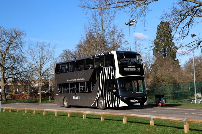 2 (RG02ZEB) is a grey Alexander Dennis Enviro400EV with a black and white zebra stripes on the front of the bus. It is a generic bus in the fleet with Z.E.B.R.A (Zero Emission Buses for the Reading Area). It is pictured on Whiteknights Campus as it headed to Lower Earley on route 21.