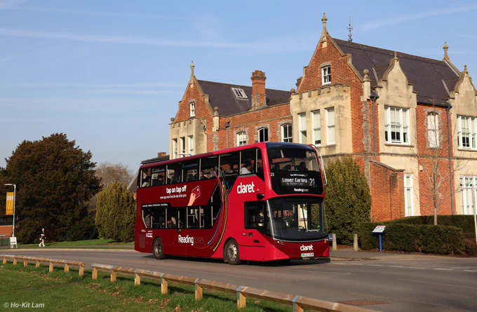 Reading Buses 23 (RG23ZEB) is a two-tone Claret Alexander Dennis Enviro400EV and is pictured opposite Old Whiteknights House as it heads to Lower Earley on route 21.