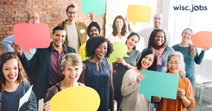 Image: Diverse group of people holding colorful speech bubble signs; Wisc.Jobs.