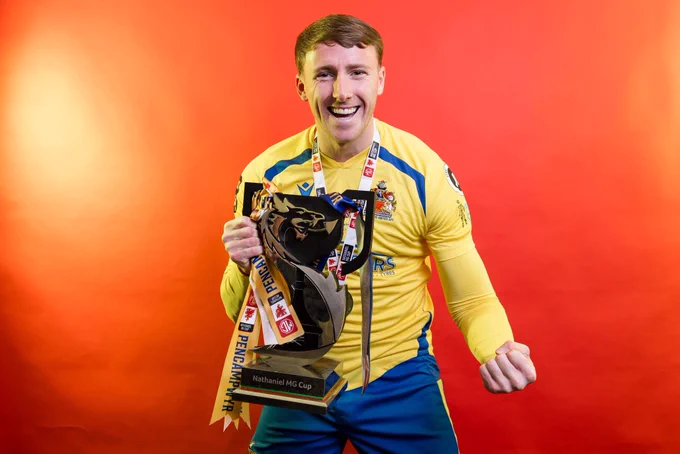 Ryan Kavanagh celebrates Barry Town United winning the Nathaniel MG Cup.