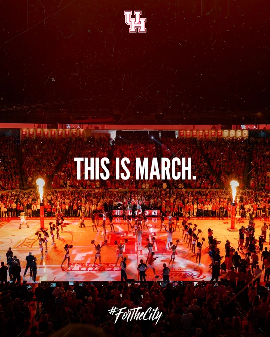 Basketball court in Fertitta Center with a large audience, cheering with pyrotechnics on the court. “This is March” is prominently displayed over the scene. The University of Houston logo is seen at the top, and "#ForTheCity" is written at the bottom.