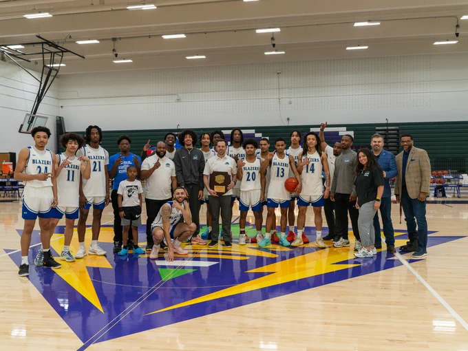 Dallas College North Lake men's basketball team celebrates with the NJCAA Division III South Central District trophy.