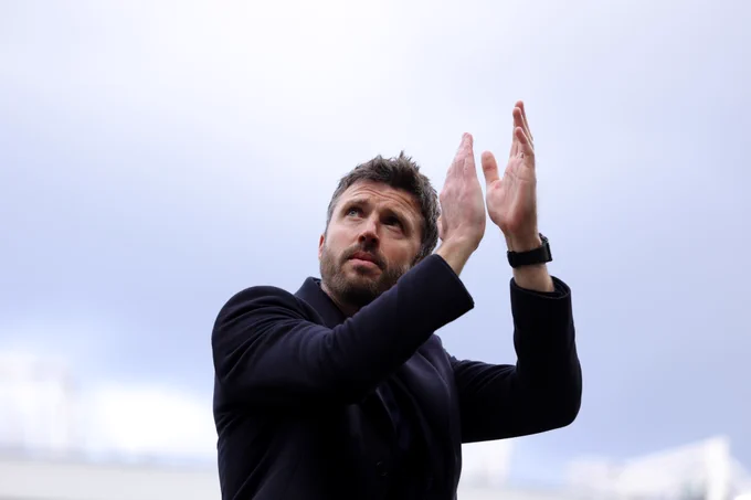 Michael Carrick applauds the Stretford End at full-time.