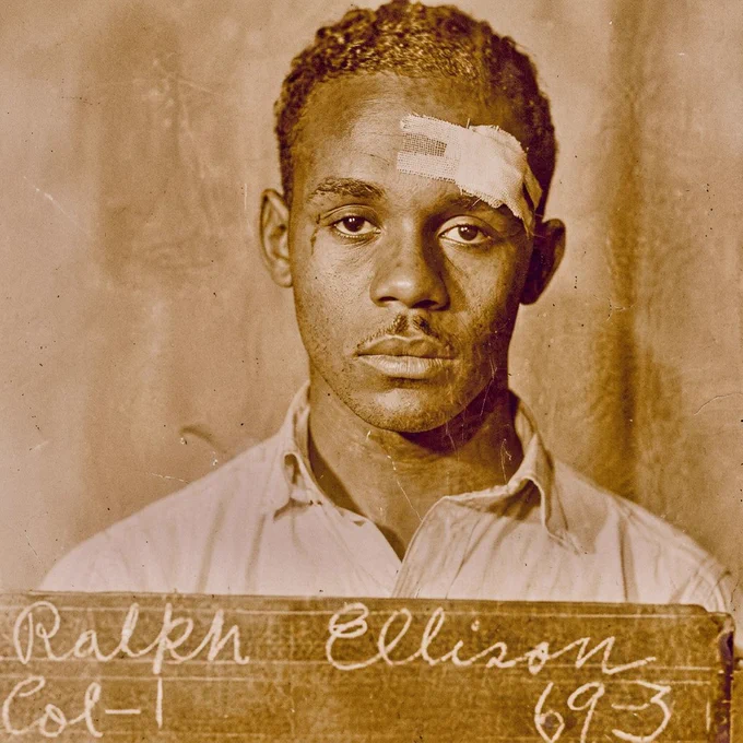 Ralph Ellison (born 1 March 1913) at the time of his university admission. Specifically, this is his student ID photograph for Tuskegee Institute, taken in 1933 when the future novelist was 20 years old.
​
The Journey to Tuskegee
In the summer of 1933, unable to afford the $36 fare from Oklahoma to Alabama, Ellison travelled as a stowaway, jumping between freight trains. During this dangerous clandestine journey, the young man was involved in a violent physical altercation in the carriages that left him with injuries to his face. This incident explains the prominent bandage on his forehead that was immortalised when his official admission photograph was taken on campus.
