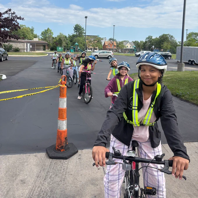 Kids on bikes wearing helmets