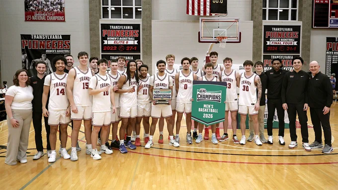 basketball team posing on the court