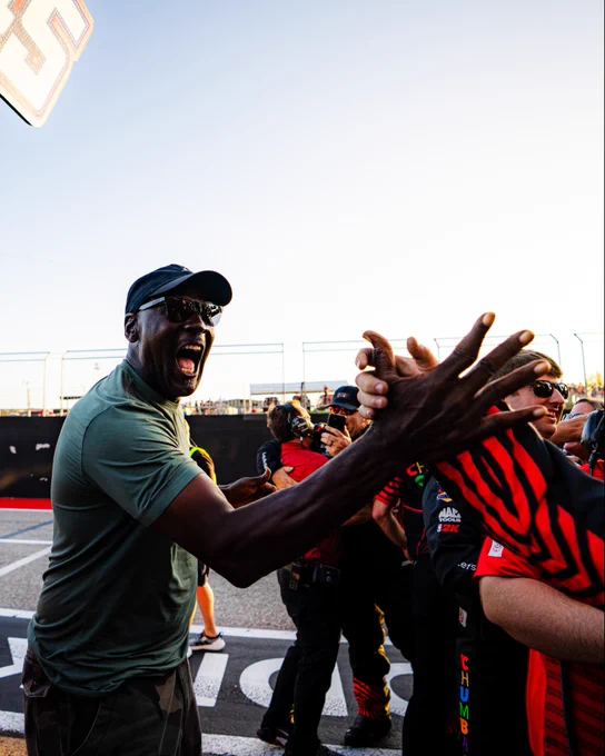 A photo of Michael Jordan celebrating Tyler Reddick’s third consecutive win at COTA in 2026.