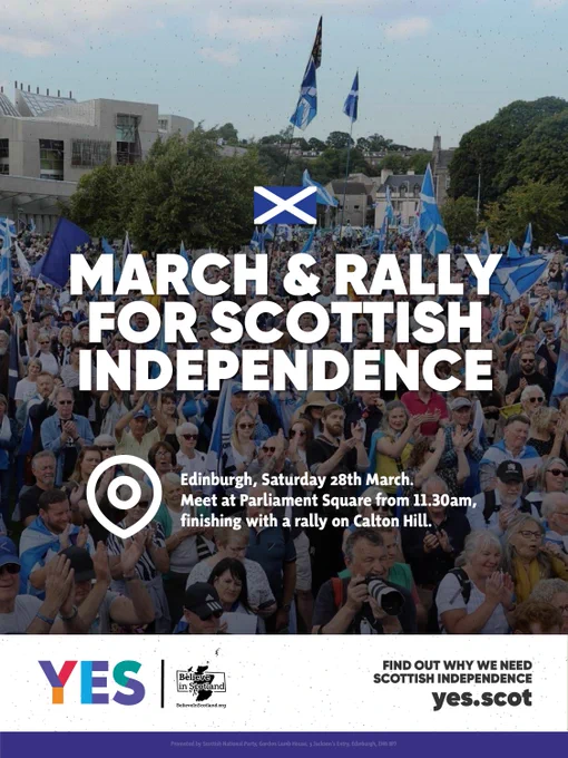 Large crowd waving Scottish flags at a rally for Scottish independence in Edinburgh's Parliament Square.