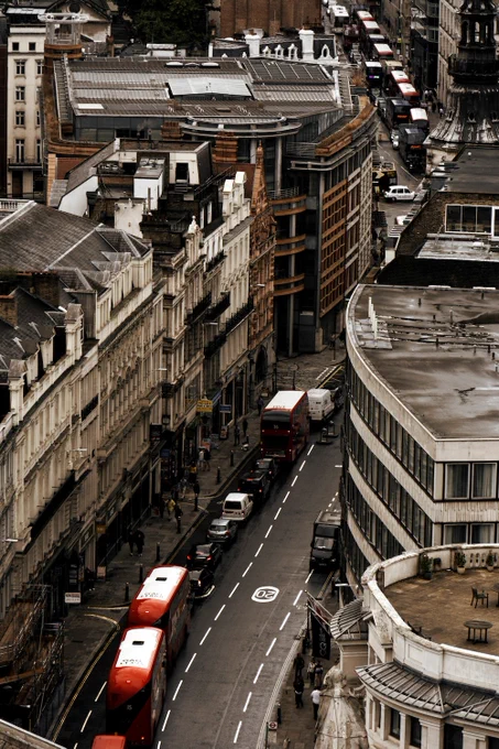 An aerial view of a London street with cars and buses