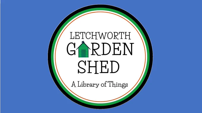 Circular logo with the text “Letchworth Garden Shed” and a green shed illustration replacing the letter A in “Garden.” Beneath it reads “A Library of Things.” The logo sits on a blue background.