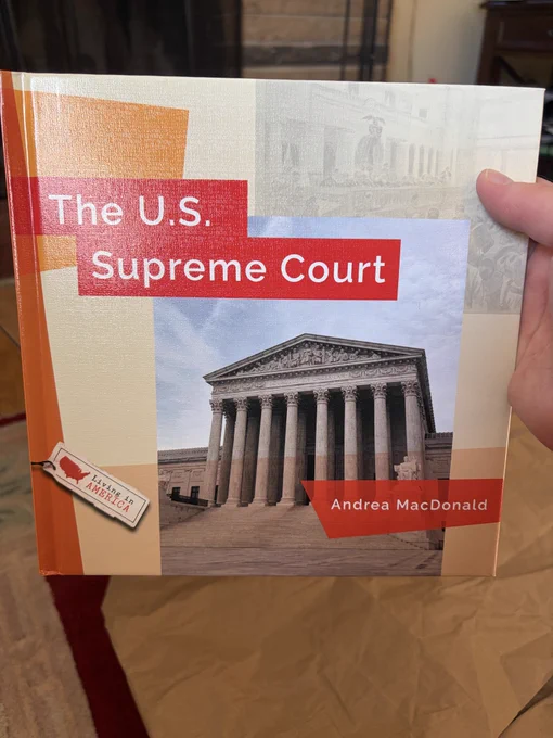 Close-up of a new educational book for middle-grade students called The U.S. Supreme Court by author and teacher Andrea MacDonald.