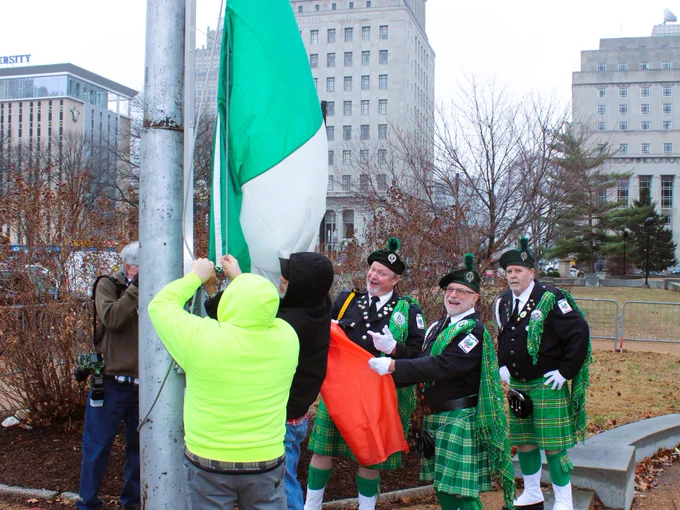 An image of the Irish flag being raised at St. Louis City Hall.