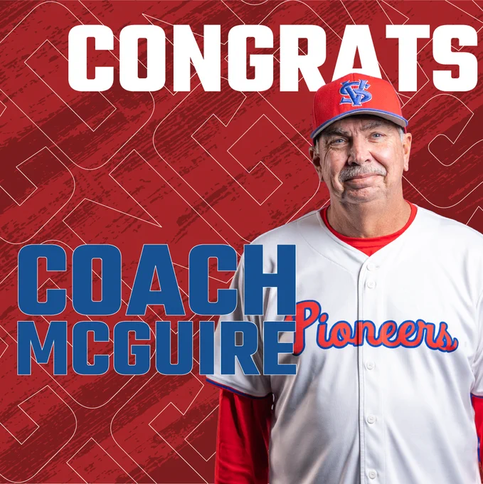 Coach McQuire, smiling in his baseball jersey.