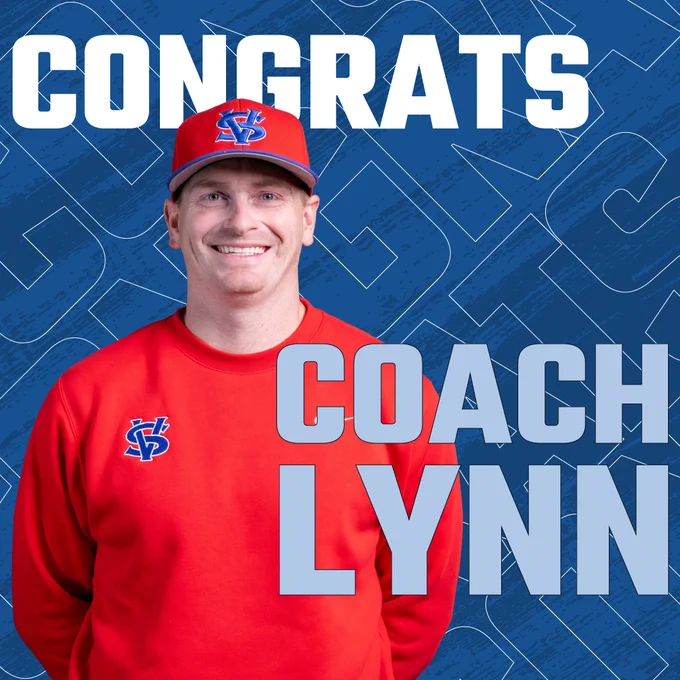 Coach Lynn, smiling in a red sweathershirt with  Vol State logo.