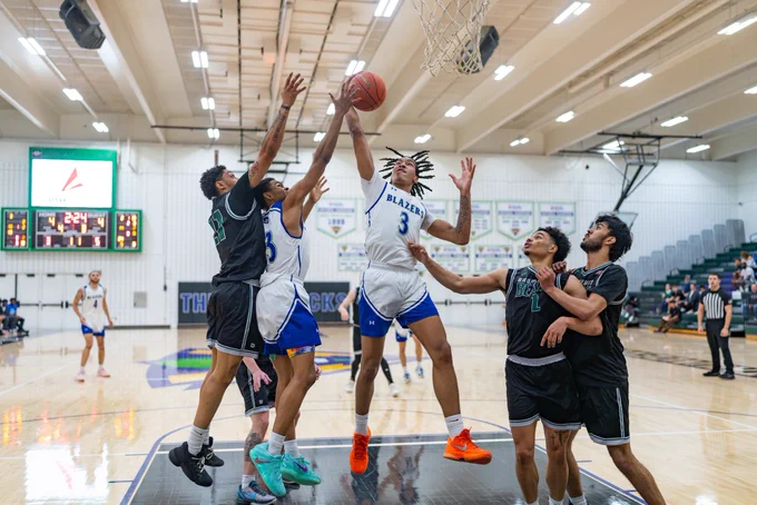 North Lake’s Zaedyn Owens reaches for the ball around the rim.