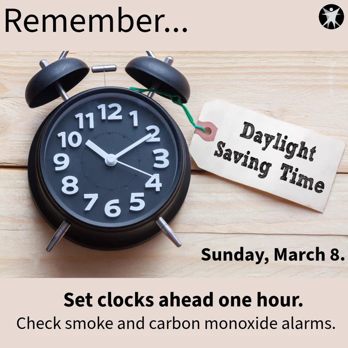 A black alarm clock with a tag that reads Daylight Saving Time, plus the date, Sunday, March 8, and the DHS logo. And a reminder to set clocks ahead one hour and check smoke and carbon monoxide alarms. 