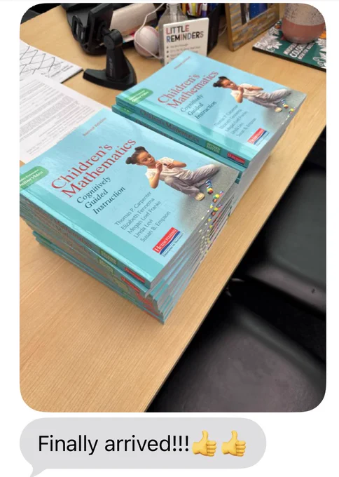A picture via text of two stacks of 9 books titled Children's Mathematics: Cognitively Guided Instruction sitting on a school desk. A text message that says "Finally arrived!!!" with two thumbs up.