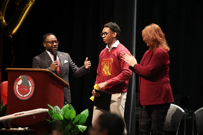 Parker and Tuskegee representatives, who present him with a scholarship