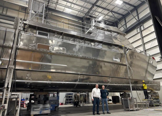 Image of Ken and Jay standing starboard on the new vessel.
